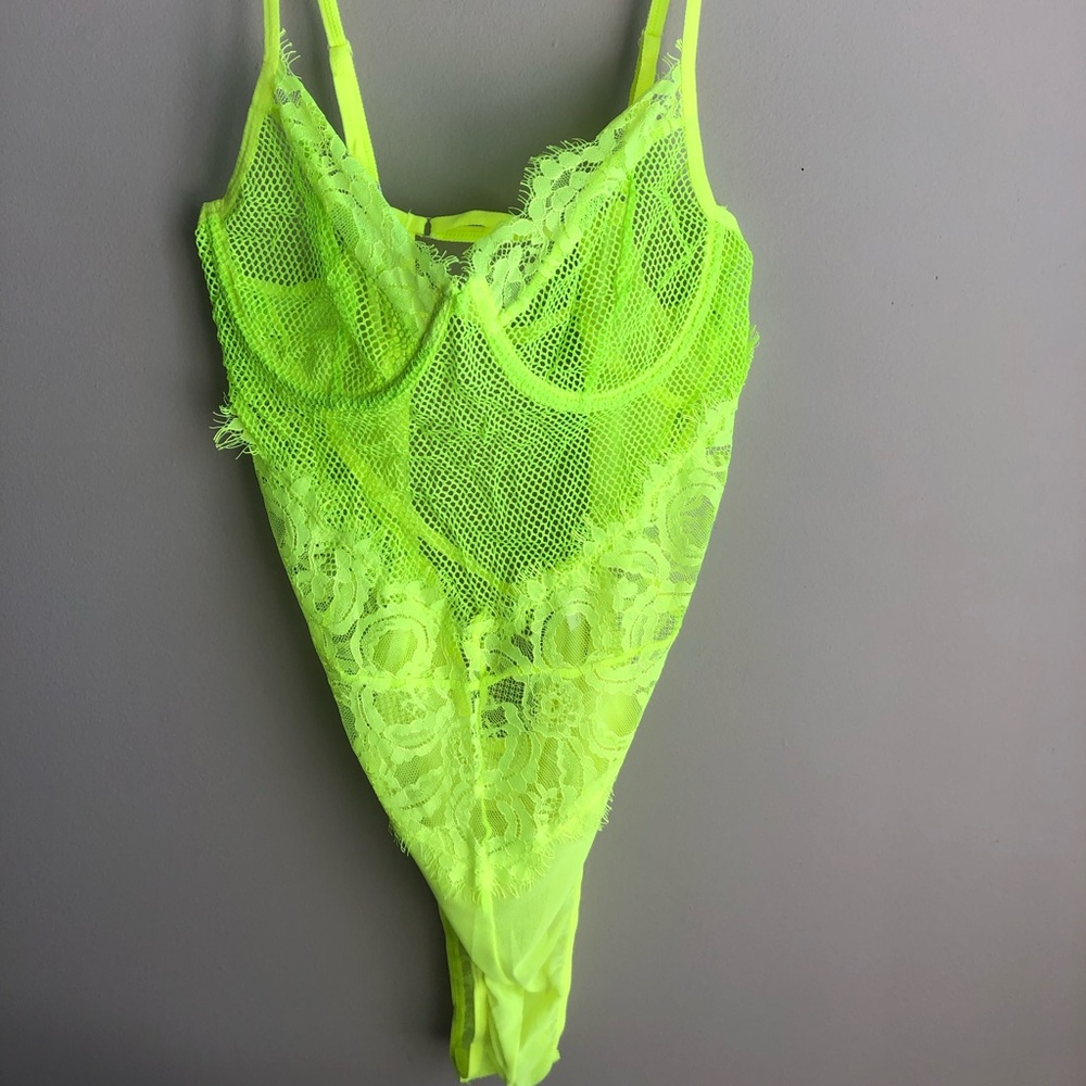 Neon yellow/green lace bodysuit.